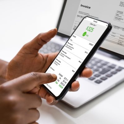 A financial planning advisor receiving payment from a digital invoice.